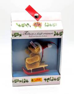 lot 2344 image: Steiff Limited Edition Button In Ear, # 667084 Teddy on a sleigh ornament Steiff North American Exclusive 2003