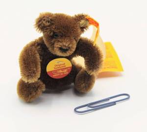 lot 2413 image: STEIFF MINIATURE ORIGINAL Pose-able TEDDY BEAR Dark Brown Pristine with all Tags attached