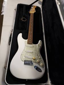 lot 4809 image: Squier Strat by Fender 6 String Electric Guitar with SKB Hard Case