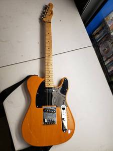 lot 4819 image: Squier by Fender 6 String Solid-Body Electric Guitar, Right Handed, Butterscotch Blonde