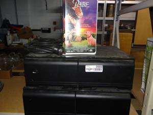 lot 3503 image: Assortment of VHS Tapes and VHS Tape Organizer