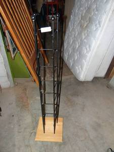 lot 3629 image: a metal DVD rack