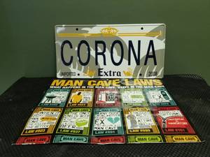 lot 6001 image: Corona License Plate and Man Cave Poster