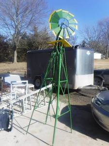 lot 11787 image: John Deere metal yard art wind mill