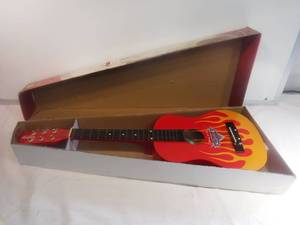 lot 11883 image: New old stock Disney cars flame body acoustic guitar child size