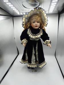 lot 9004 image: a 2.5 ft porcelain doll with stand for display