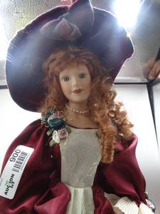 lot 9008 image: 16 red haired victorian style porcelain doll with matching red satin dress and bonnet