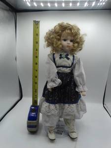 lot 9028 image: 16 curly haired heritage mint porcelain doll