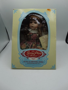 lot 9056 image: heritage mint 14 porcelain sitting doll from the sitting pretty collection (patty)