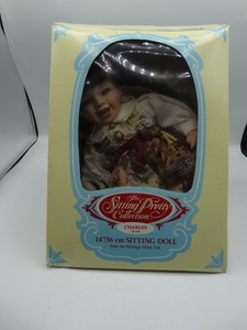 lot 9054 image: 14 heritage mint sitting porcelain doll from the sitting pretty collection