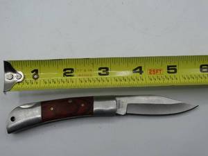 lot 9133 image: 6 stainless steel pocket knife with a NRA design on the blade