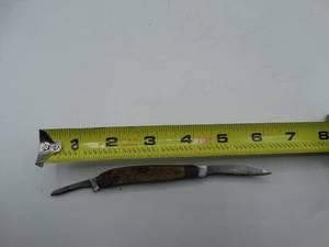 lot 9134 image: approximately 6  double edged sabre pocket knife