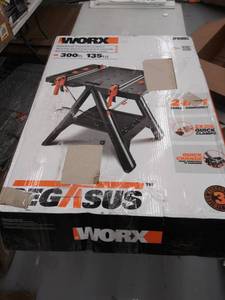 lot 15814 image: WORX Pegasus Multi-Function Work Table and Sawhorse with Quick Clamps and Holding Pegs �� WX051