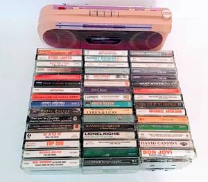 lot 3114 image: (48) Cassettes and Vintage Pink Sidestep Cassette Player with Radio