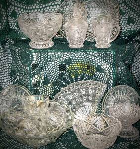 lot 3129 image: 17 Piece Variety of Beautiful Cut Glass Crystal, 4 Cups, 4 Saucers, 1 Lg Serving Bowl, 5 Small Bowls, Creamer and Sugar Bowl, Hors D Oeuvres
