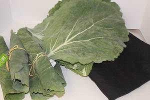 lot 3213 image: Table Decor including Black Tablecloth, Cabbage Napkins and Placemats