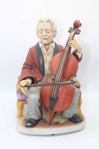 lot 3015 image: Vintage WACO Musical Melody In Motion The Cellist playing A Time For Us