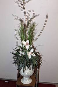 lot 3244 image: Beautiful 48 Tall Planted Foliage in White Earn Pot with handles