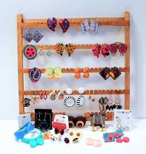 lot 3361 image: HUGE lot of Costume Earrings and Wooden Earring Display Rack - there are a couple of bracelets too