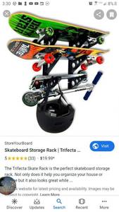 lot 5623 image: Blasm M Products Skateboard Rack. 3 pair