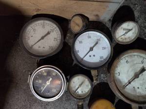 lot 6562 image: Wood Box Full of Gauges
