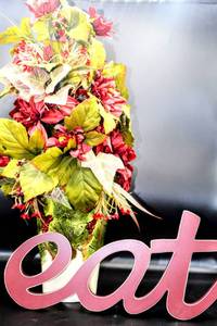 lot 3431 image: Beautiful Floral Arrangement in Ceramic Painted Pot 10.5 (could work to hold utensils) and Coordinating Eat sign 16 wide