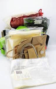 lot 3537 image: Large Variety of Gift Bags - New in pkg - Drawstring Fabric bags, Various Sizes Clear Cellophane Bags, Craft Paper Bags, Handled Plastic Bags....
