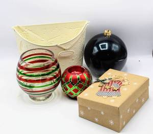 lot 3772 image: Variety of Christmas Holiday Decor - Ivory Metal Holiday Cards WallDoor Hanging, Green & Red Ornament Candle Holders, Large Black Ball Ornament and Country Christmas Angel Box