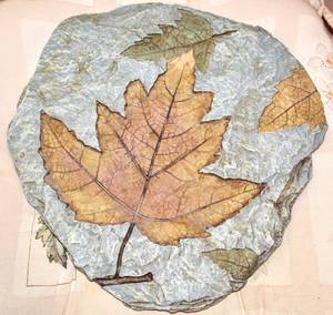lot 3847 image: Garden Stone, 3 Chair Cushions, Large Glass Jar with Lid, Roll of Landscape Fabric, Vintage Antique Metal Enameled Pot 18 x 13