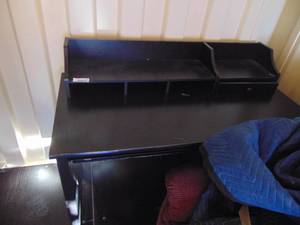 lot 2444 image: Dark colored Desk - Damage on right side as pictured