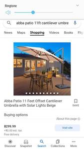 lot 35275 image: Abba Patio 11 Feet Offset Cantilever Umbrella with Solar Lights BeigeRetail Price 299.99
