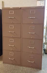 lot 6022 image: 2 Yawman-Erbe Legal Size 4 Drawer Filing Cabinets  Each one is 18 in. x 28 in. x 51 in.  one key but seems to work both locks