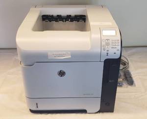 lot 6125 image: HP Laser Jet 600 M602 Printer w cable and extra rollers  16 in. x 20 in. x 16 in.