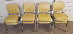 lot 6174 image: Lot of 8 Mustard Yellow Vinyl Stacking Chairs  some the vinyl is torn