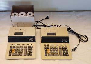 lot 6196 image: Lot of 2 Canon MP25D Adding Machines  powers on  wbox of paper rolls
