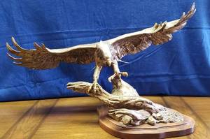 lot 6242 image: Wings of Freedom  Soaring Eagle Bronze wSilver Head and Tail Feathers  Sandy Scott  Wing Span 39 in.  Height 22 in. Tall  Depth 24 in. Front to Rear  Valued over $2700