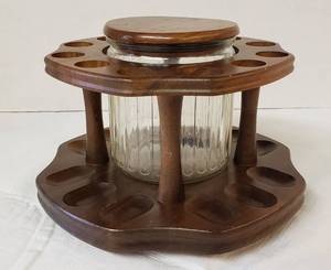 lot 6294 image: Walnut Tabletop Lazy Susan Style 12 Pipe Holder with Lidded Tobacco Jar  9 in. wide & 6 in. tall