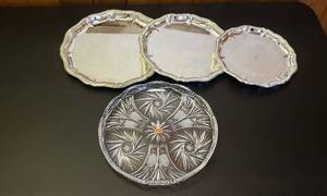 lot 6377 image: Lausitzer Lead Crystal Hand Cut Platter (12 38 in. wide) and Collection of 3 Silverplated Trays (10, 12, & 14 in.wide)