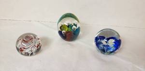 lot 6386 image: Collection of 3 Glass Paperweights  All are 2 12 in. wide but different heights