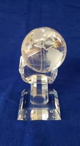 lot 6393 image: Crystal Sphere World Globe in a Hand Base (also crystal) 6 12 in. tall and 3 x 3 in. base