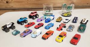 lot 1044 image: Various Little Vehicle Toys  Various Makers & Styles and 2 in the Bottom of Cups