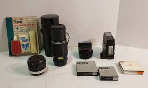 lot 1067 image: 35 mm Camera Accessories  Pentax-M Zoom Lens 14.5, Vivitar 2x Lens, Targus Flash, Sunpak Flash, 3 Filters and Lens Cleaning Kit