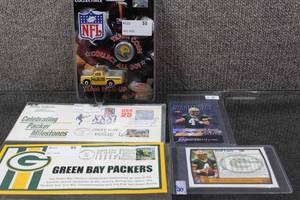lot 3119 image: Lot of Brett FavreGreen Bay Packers Memorabilia, Includes 1997 Magnifield Score Board & 1999 TOPPS Cards, 2 First Day of Issue Stamps, & Team Collectible Coin and Diecast Pickup Truck - WILL SHIP