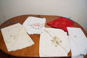 lot 5104 image: Lot of Table Clothes, Some appear hand embroidered Pressed & Clean were hanging and covered Nice