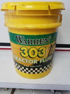 lot 1217 image: Warren 303 tractor fluid about 2 12 gallons