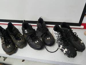 lot 1238 image: three pairs of Under Armour cleats
