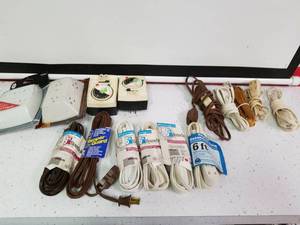 lot 1305 image: 11 extension cords and 2 grounded outlets