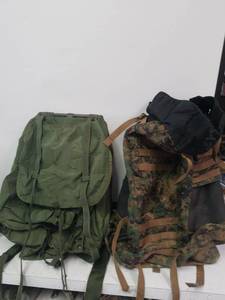 lot 1319 image: Military backpack and camo backpack