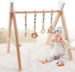 lot 1365 image: Baby Wood Gym with 4 Wooden Gym Toys Baby Teethers