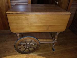 lot 3330 image: Vintage Side Table with Outer Leafs. Wheels and Lower Tray and Drawer. Contents Included